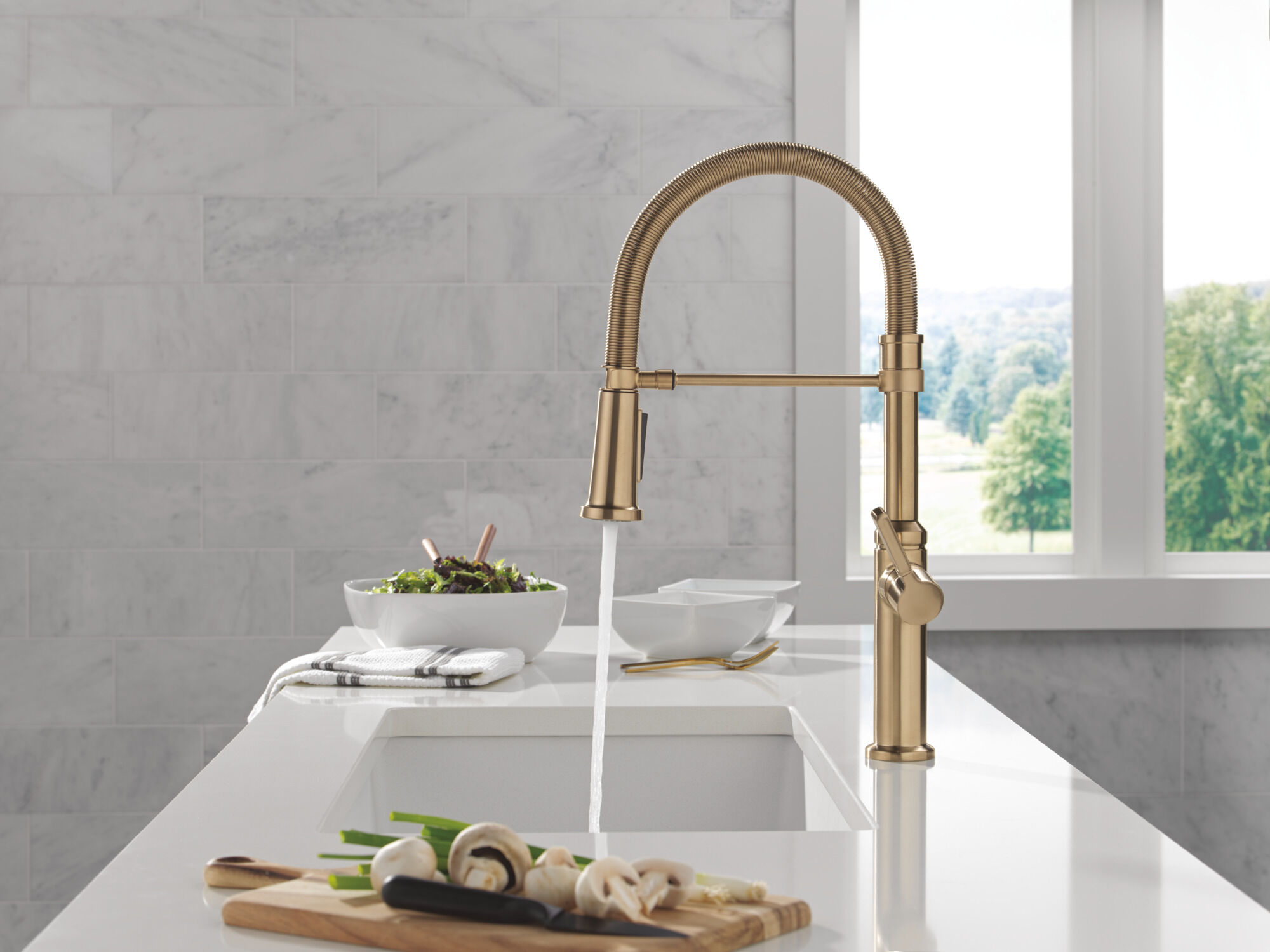 Single Handle Pull-Down Spring Kitchen Faucet in Champagne Bronze