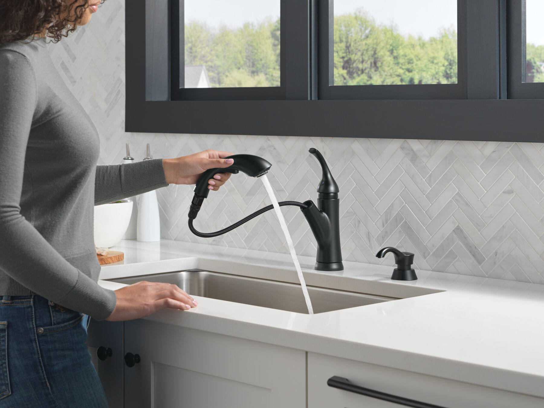 Single Handle PullOut Kitchen Faucet with Soap Dispenser in Matte Black 16932BLSDDST Delta
