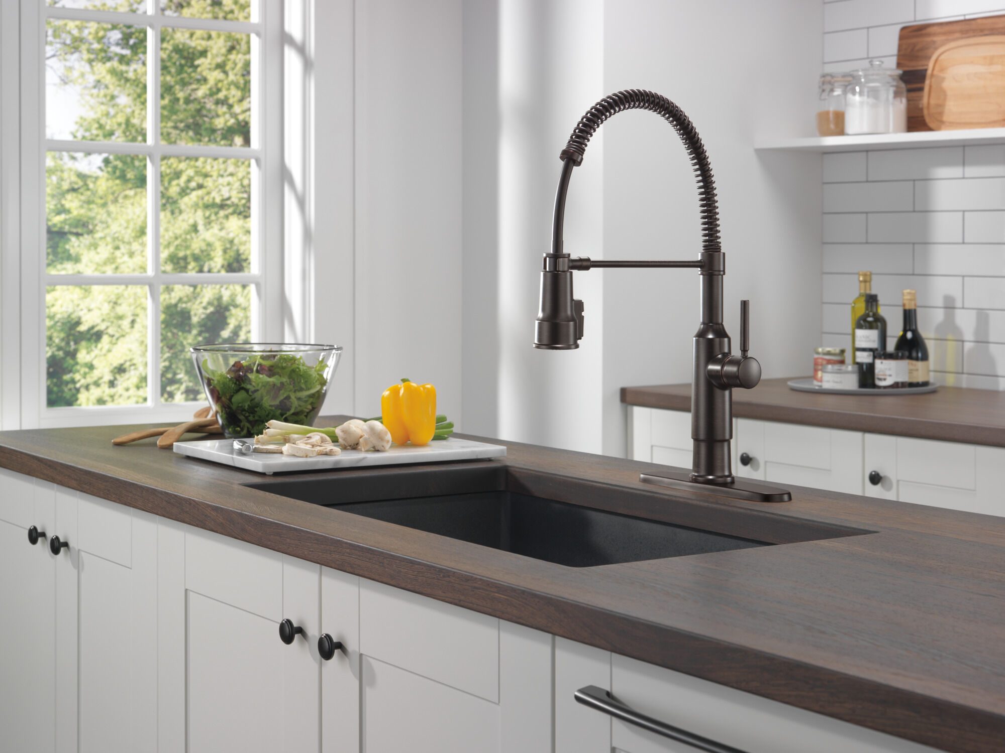 Single-Handle Pull-Down Spring Kitchen Faucet in Venetian Bronze