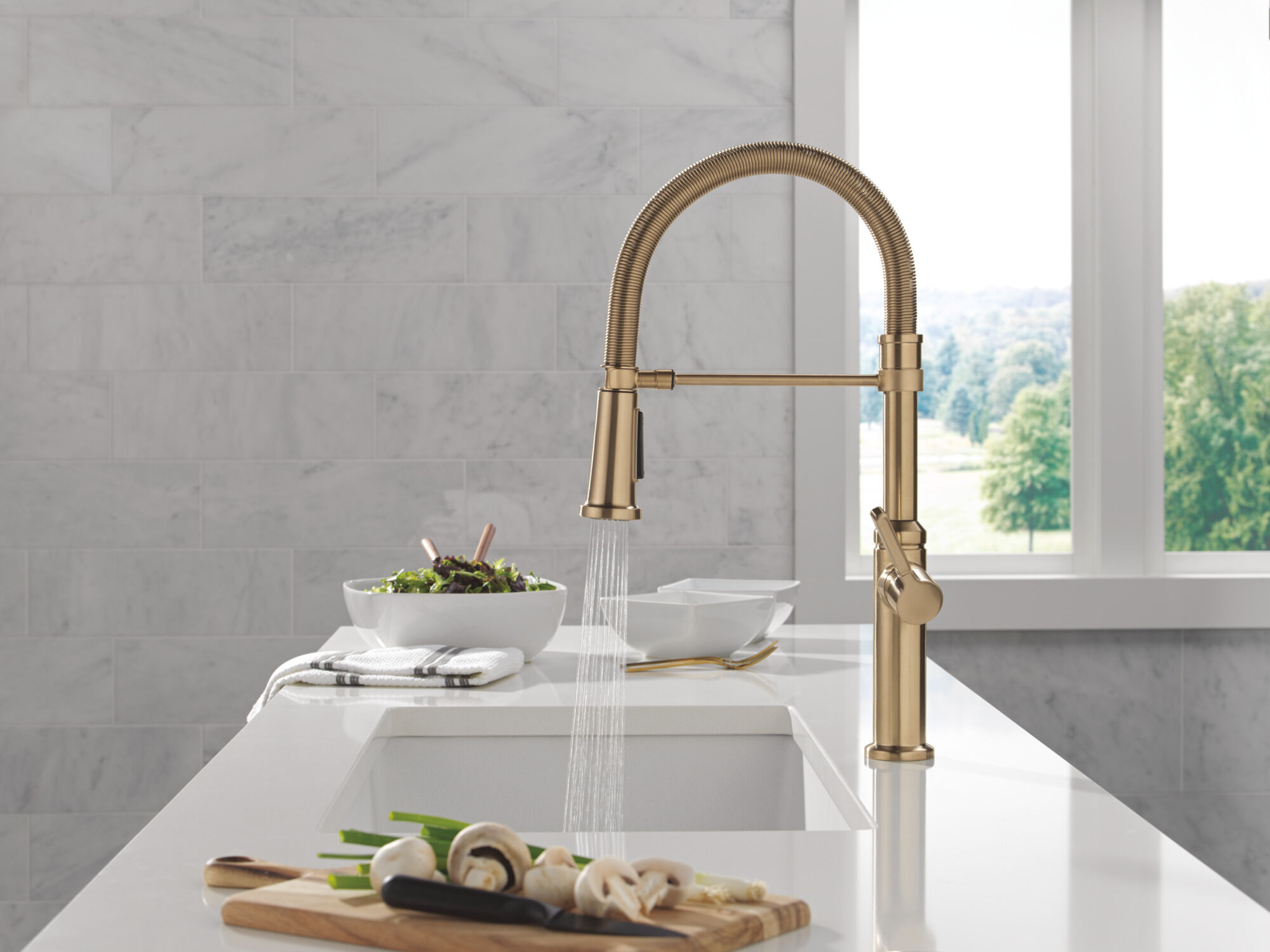 Single Handle Pull-Down Spring Kitchen Faucet in Champagne Bronze