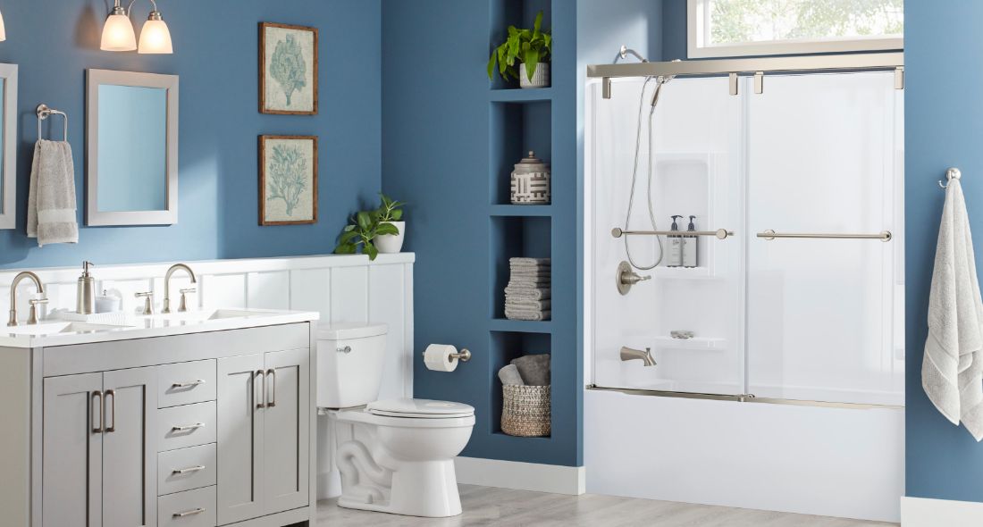 https://www.deltafaucet.com/sites/delta/files/2022-08/bright-blue-bathroom-with-acrylic-shower.jpg