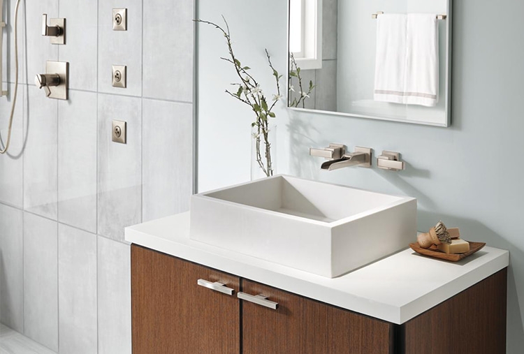 https://www.deltafaucet.com/sites/delta/files/2023-02/wooden-vanity-with-square-sink-and-wall-mount-faucet.jpg