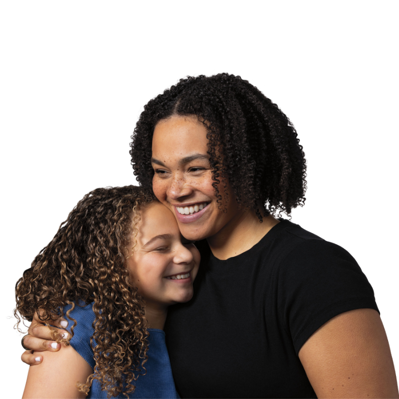 mother and daughter with curl hair hugging and smiling