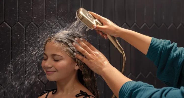 mother washing her child's hair