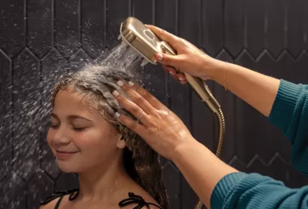 mother washing her child's hair