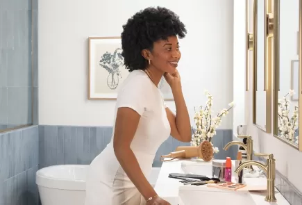 Woman adjusting her curly hair