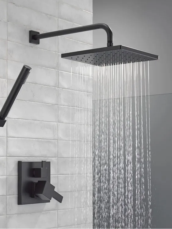 Delta matte black Square Pressure Balance Shower Kit working in shower stall with light grey tile.