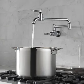 Delta Broderick Wall Mount Pot Filler in Chrome pouring water into a large pot.