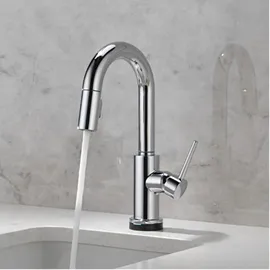 Trinsic Touch2O Bar / Prep Faucet with Touchless Technology in Chrome pouring water into a sink.
