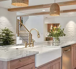 Contemporary bathroom with a Delta faucet mounted on a clean, minimalist vanity, creating a calm, spa‑like atmosphere.