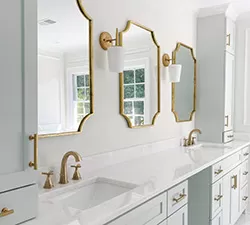 Everyday kitchen scene showing a Delta pull‑down faucet in use, with natural lighting highlighting the sink and surrounding workspace.